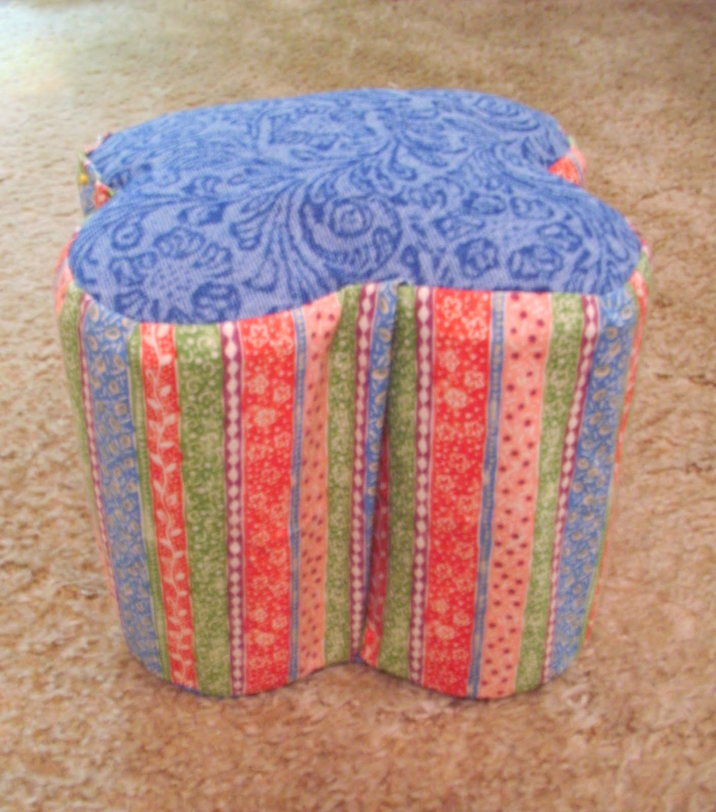 little ottoman (or stepping-stool) made out of cans