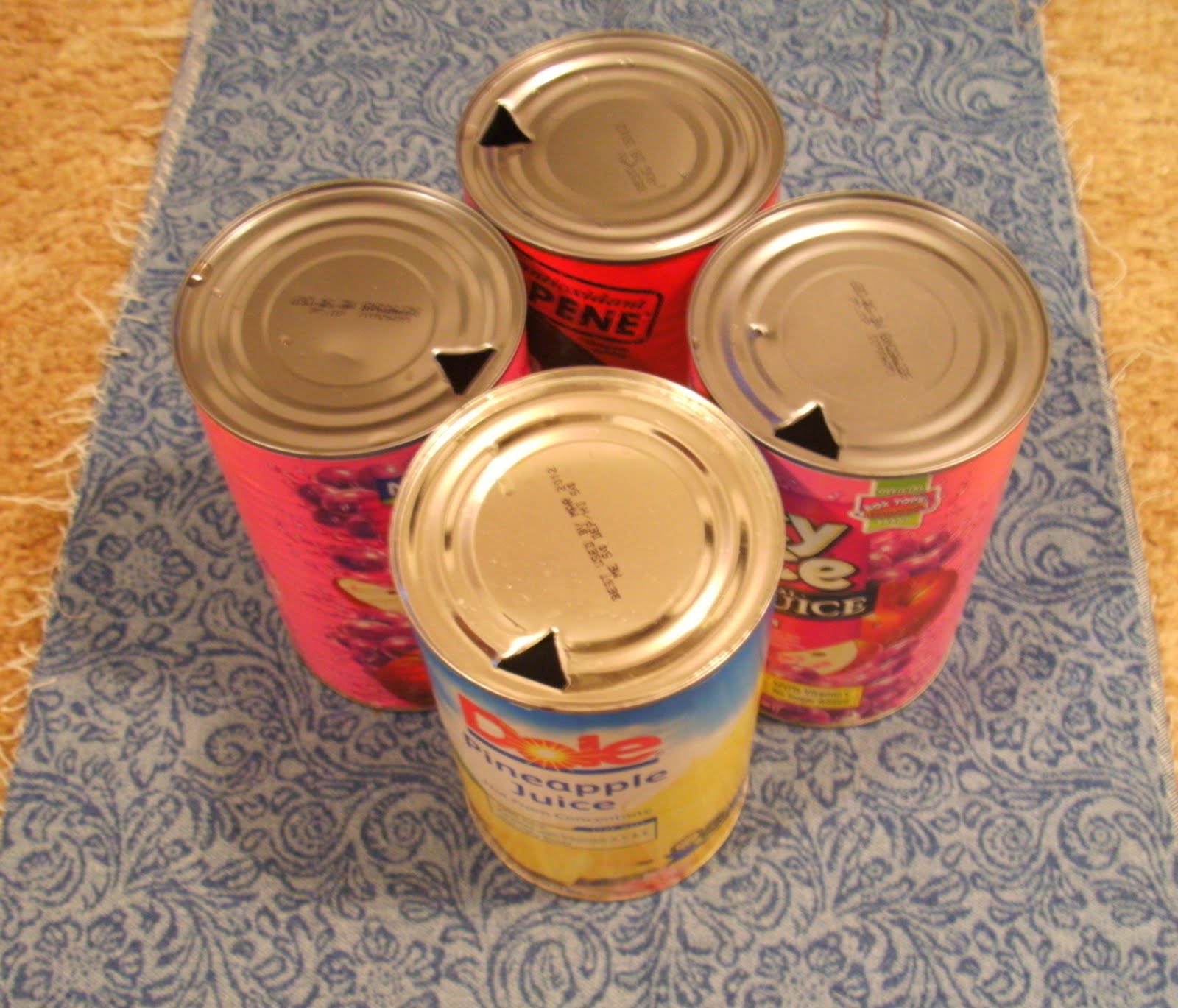 Put the juice cans together